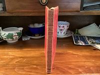 Book standing to show spine with gilt title and tooling
