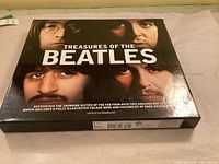 Front of boxed slipcase showing title and Beatles images