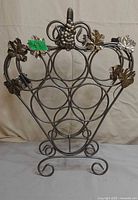 Front view showing grape and leaf details and bottle holders