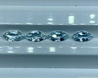 Four marquise aquamarines in row front view
