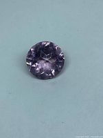 Top view of round pale lavender amethyst showing rose-cut facets