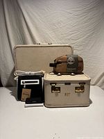 All items group view including suitcase, vanity case, Timberland bag, black bag, wallet, belt