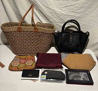 Group view of all bags, clutches, wallet and cooler bag