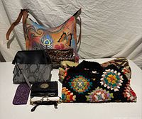 Group view of major bags, pouches, wallets, eyeglasses and phone case