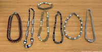All seven jewellery pieces laid out for identification