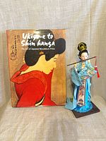 Doll and book front view