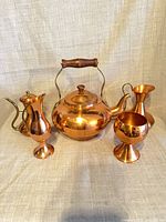 Front view of all five copper pieces