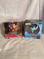 Front view of both boxed figures: Shazam Wacky Wobbler and Disney Dorbz Maleficent.