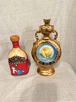 Front view of both decanters showing design, labels and stoppers