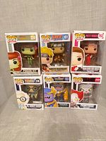 Front view of all six boxed Funko Pop! figures