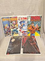 Front view of all six bagged comics standing upright