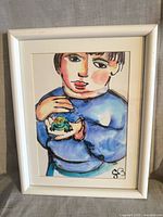 Full view of framed painting showing child with frog