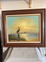 Front view of framed seascape painting