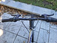 Handlebars, brake levers and grips of Supercycle bicycle