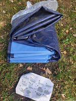 Folded blue pool panels with instruction sheet