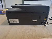 Rear and side view of HP OfficeJet Pro 6968 showing ports and power cord