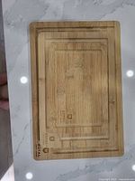 Three stacked bamboo cutting boards showing size gradation and Royal Craft Wood branding