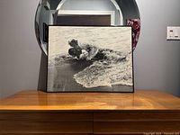 Front view of framed photograph showing image and frame