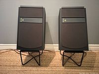 Front view of both Wharfedale 2180 speakers on metal stands