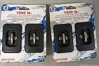 Front view of two sealed twin packs showing all four anchors