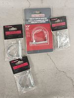 Group shot of four Motomaster trailer coupler latch pins in original packaging