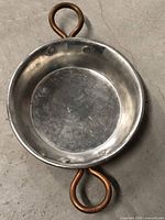 Interior view showing stainless steel lining and loop handles