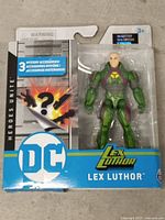 Front of sealed DC Heroes Unite Lex Luthor figure package showing figure and accessory callout
