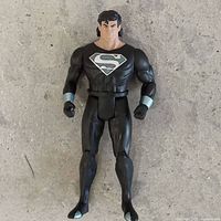 Front view of black-suit Superman action figure