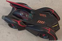 Angled top-side view of Batmobile showing body shape, canopy and red accents