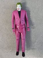 Front view of Joker action figure in pink suit