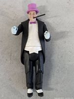 Front view of Penguin action figure displaying attire and accessories