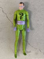 Front view of The Riddler action figure showing suit, symbols, and articulation
