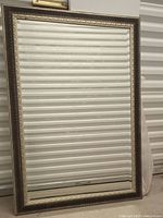 Full view of framed rectangular mirror front