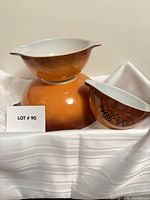 All three bowls displayed on cloth, showing sizes and colors