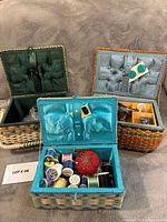 All three open baskets showing interiors, threads and notions