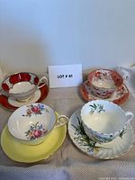Group shot of four teacup and saucer sets