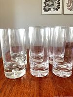 Six clear glass highball tumblers front view