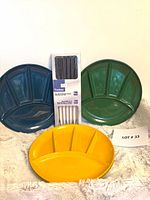 Three divided plates in blue, green, yellow with boxed Trudeau fondue forks