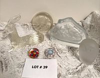 Group shot of all six glass paperweights