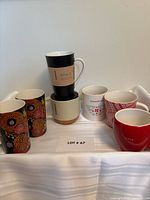 Seven mugs staged together to show full lot