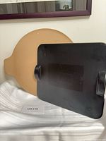 Rectangular and round pizza stones together front view