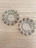 Top view of two clear glass dishes showing bubble rim