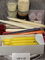 overall lot with jar candles, boxed yellow tapers, loose coloured tapers, lavender tea lights, red votive