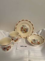 Group shot showing Bunnykins plate, bowl and three mugs