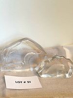 Both crystal paperweights side by side