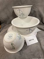 Set of three Corelle Shadow Iris mixing bowls nested together showing pattern and sizes