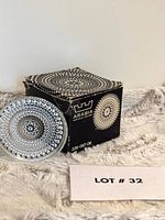 Box with one coaster leaning, Arabia Finland branding visible