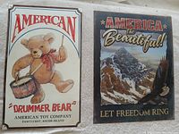 Front view of both metal signs side by side