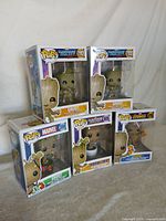All five boxed Funko Pop! Groot figures displayed together