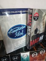 Box sets of 24 series VHS tapes alongside American Idol and Mad Men titles